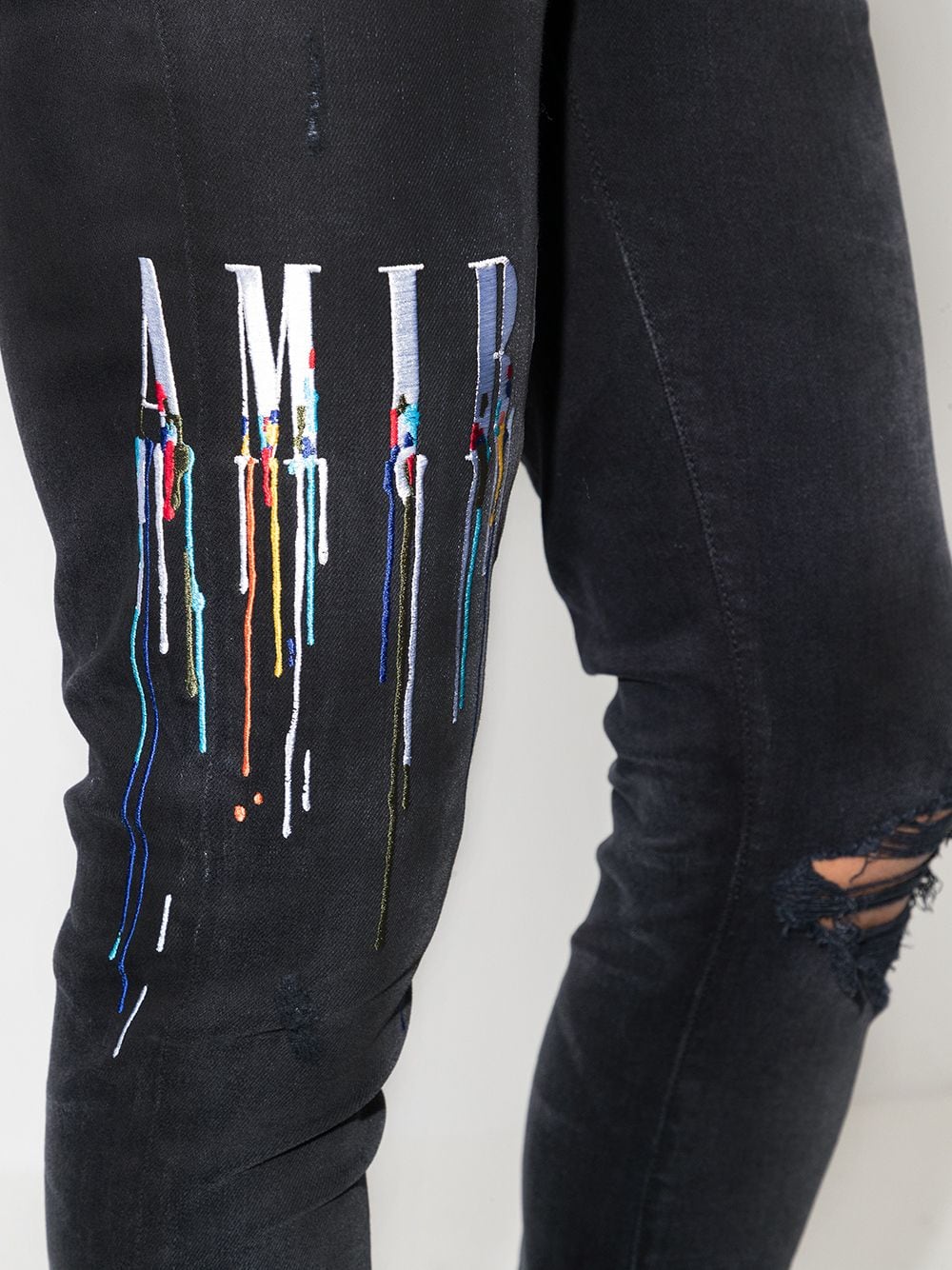 AMIRI logo-embroidered skinny jeans