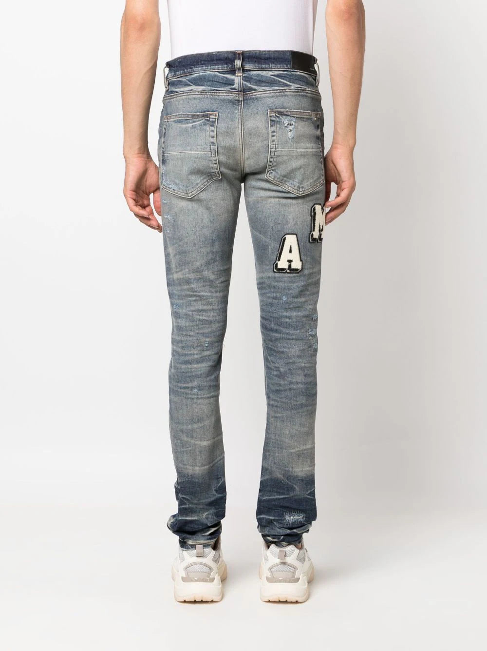 AMIRI  Varsity ripped skinny jeans