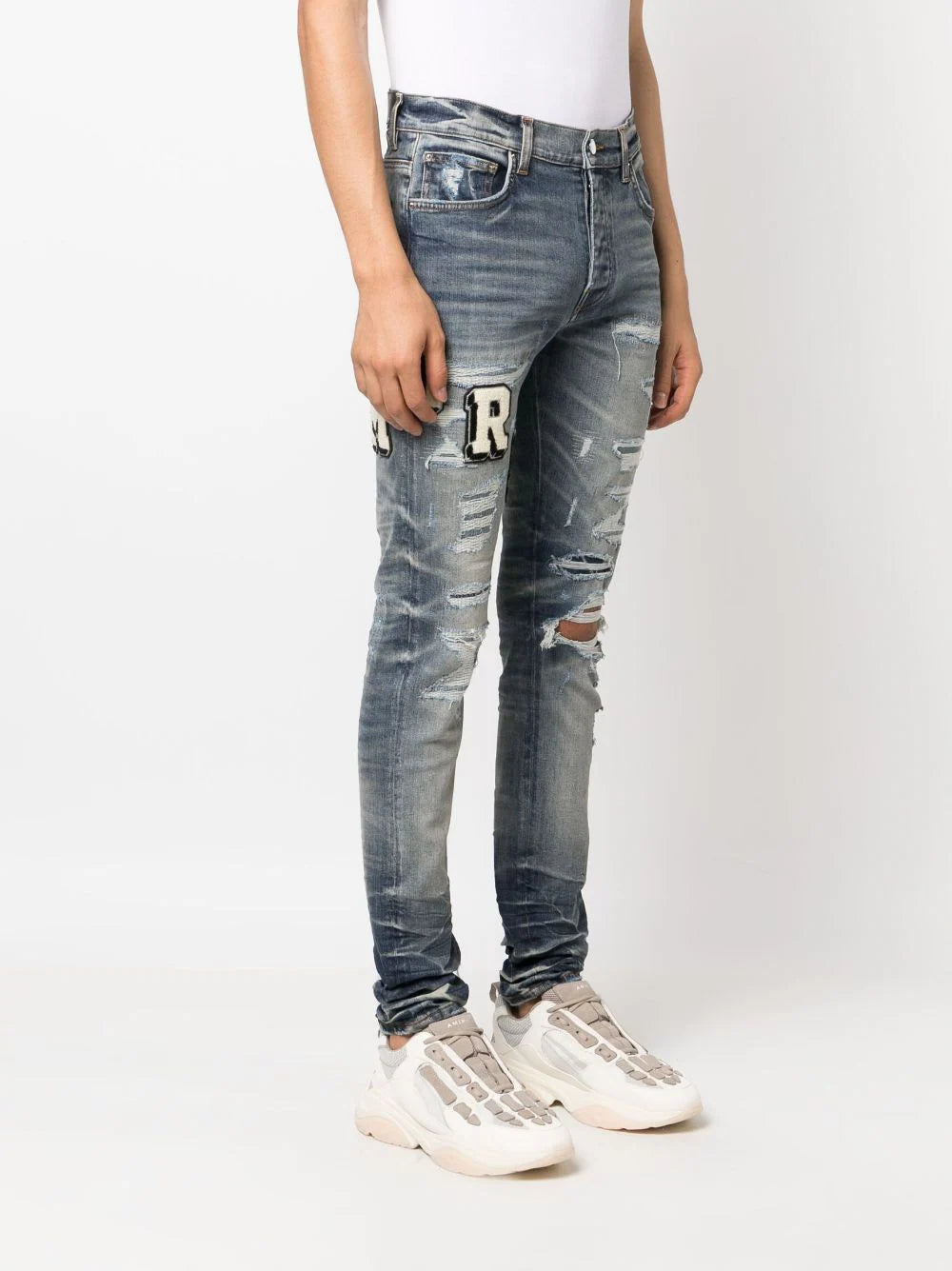 AMIRI  Varsity ripped skinny jeans
