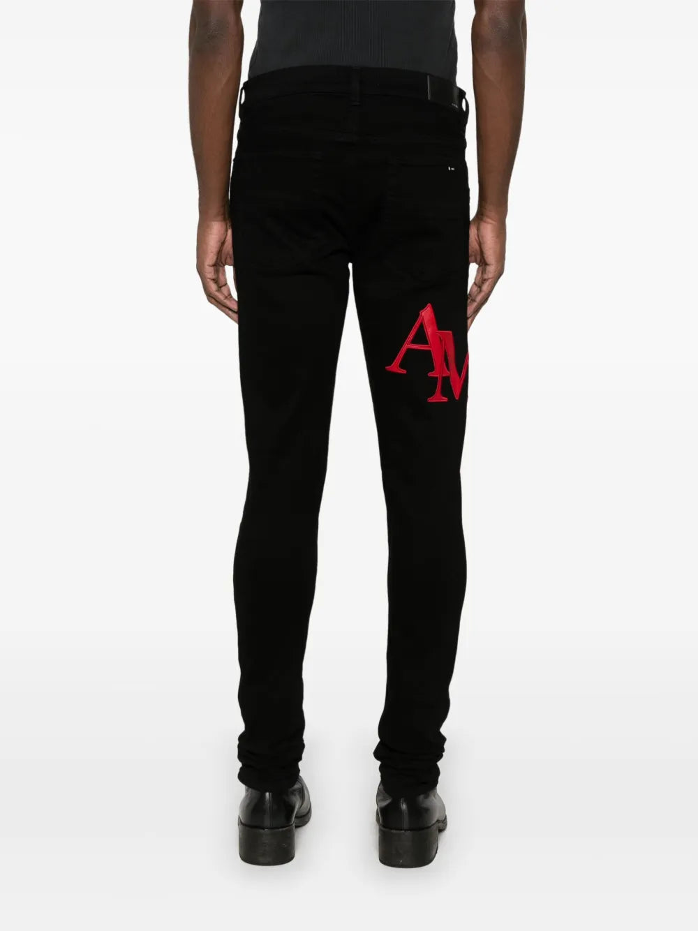 AMIRI  Staggered-logo-embroidered jeans
