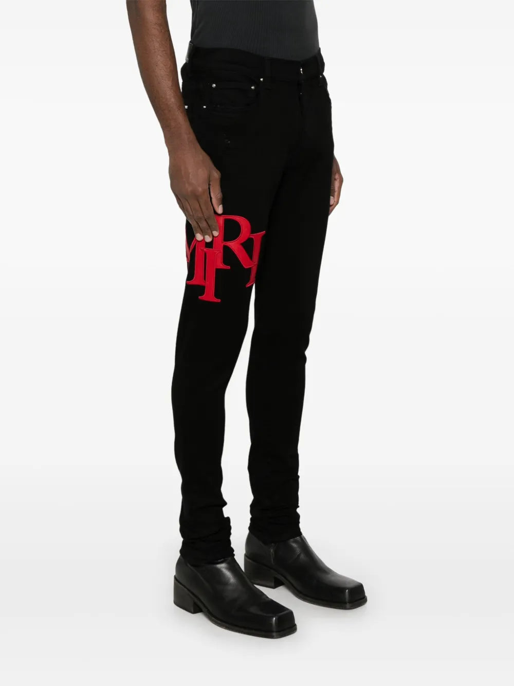 AMIRI  Staggered-logo-embroidered jeans