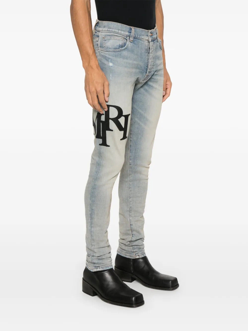 AMIRI  Staggered-logo jeans