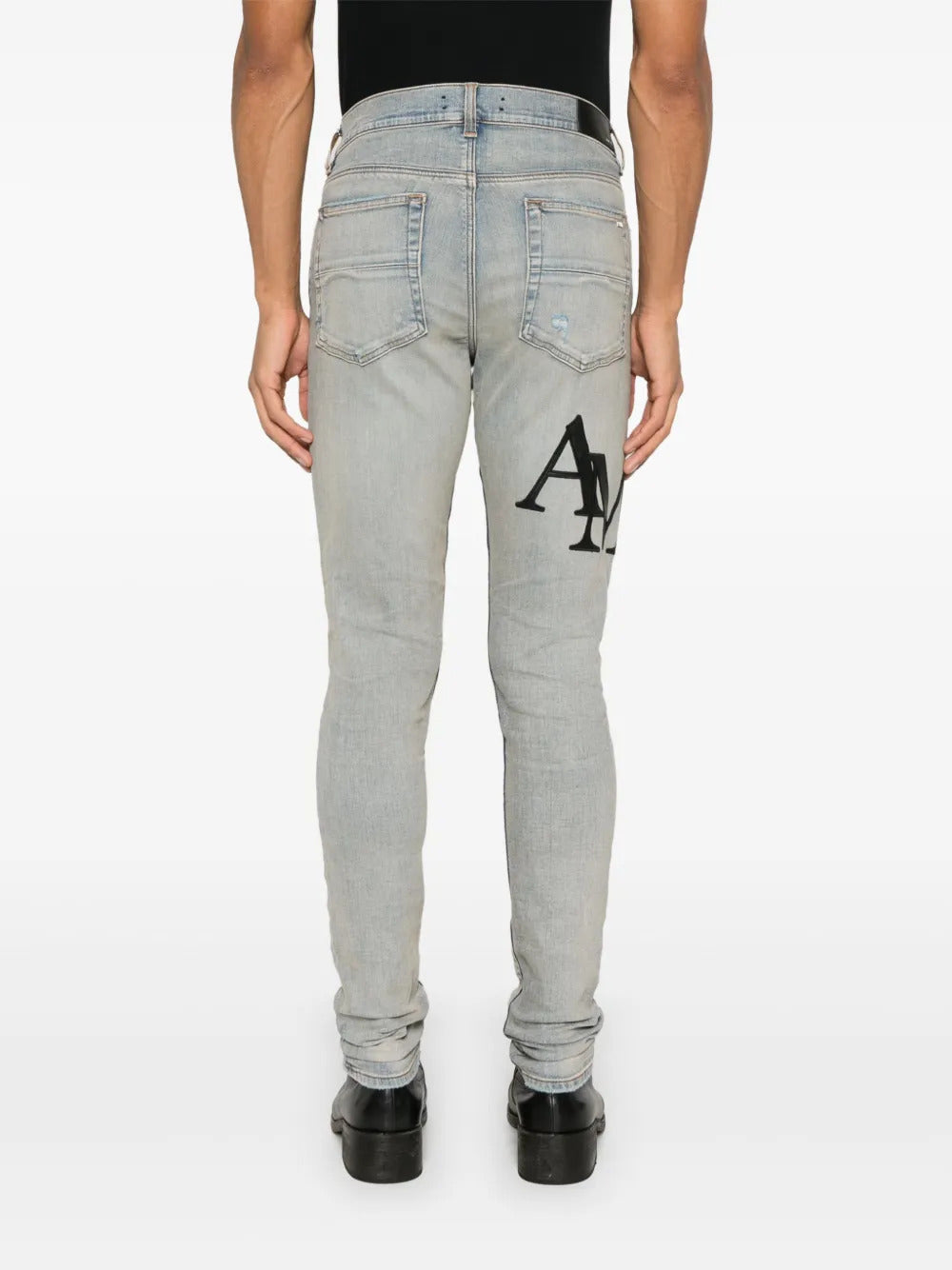 AMIRI  Staggered-logo jeans