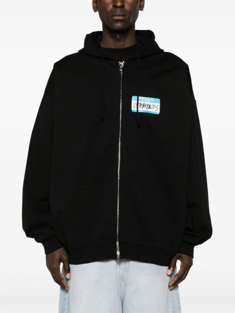 VETEMENTS  Name-tag print zip-up hoodie