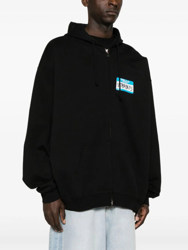 VETEMENTS  Name-tag print zip-up hoodie