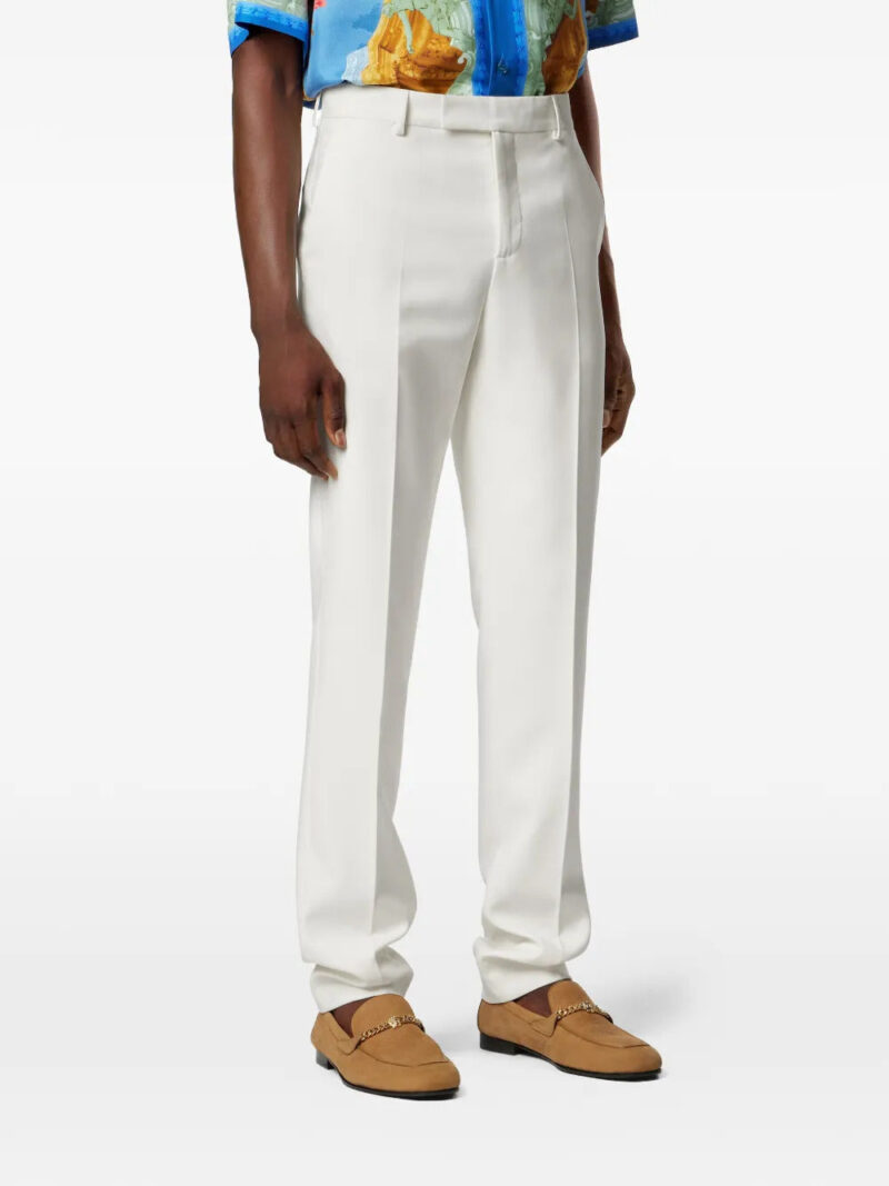 Versace logo-patch trousers