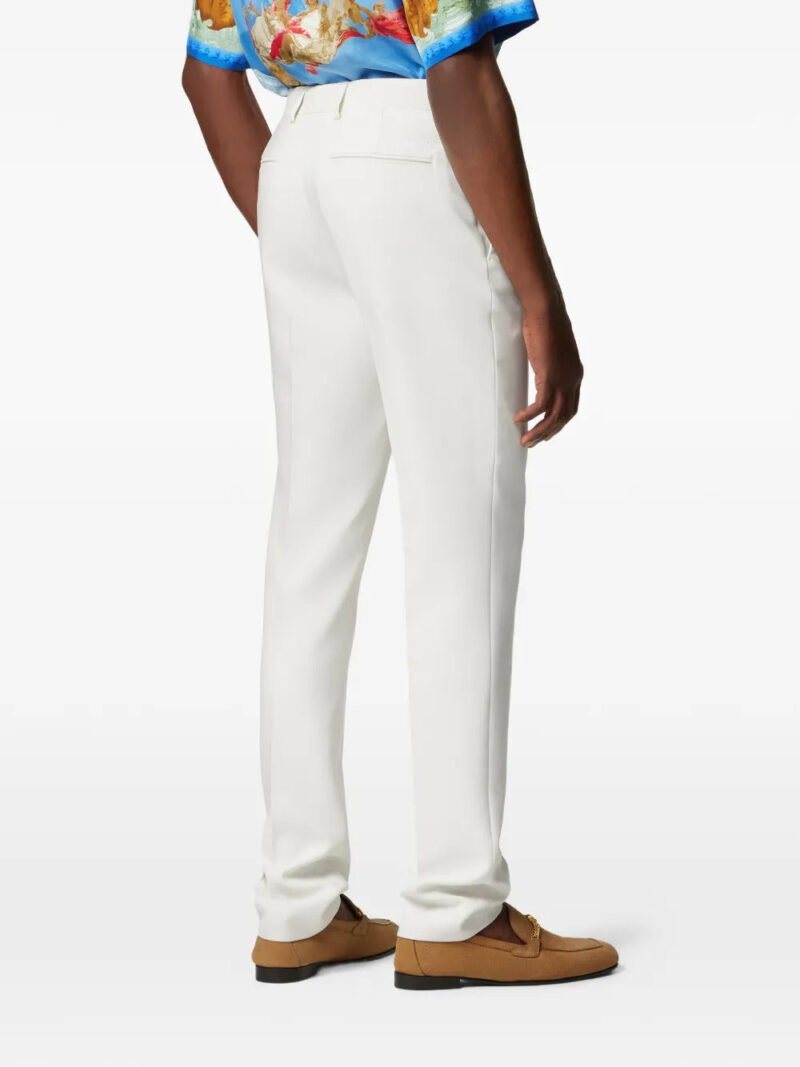Versace logo-patch trousers