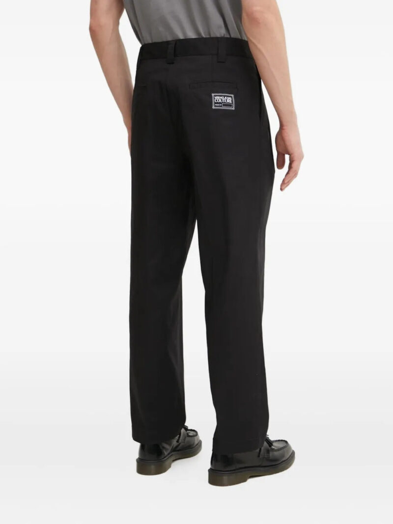 Versace Jeans Couture logo-appliqué pleat-detail trousers